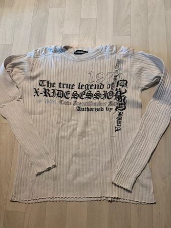 Pull overgame 14 ans blancs et noir très bon état