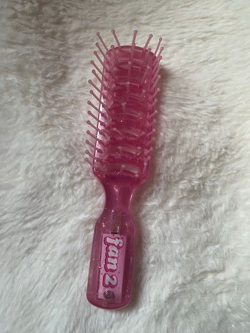 Petite brosse à cheveux lumineuse pour enfant ou collectionneur (pile à changer)