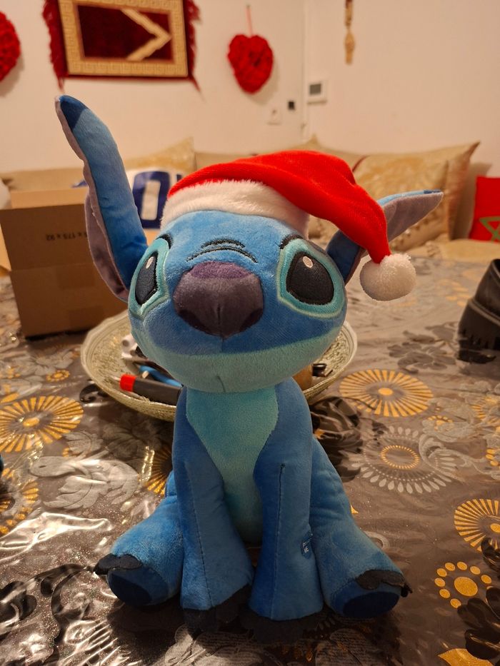 Peluche stitck parlante  hauteur 30 cm prix 8 euro