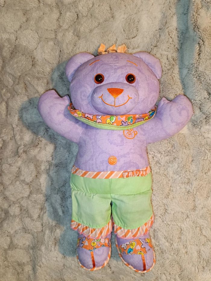 Peluche ourson mauve vert orange souple neuf