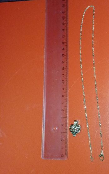Chaine argentée maille torsadée pendentif coeur ajouré qui s'ouvre