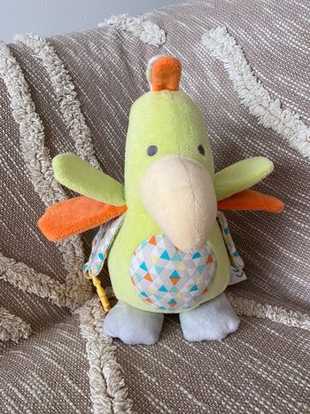 Peluche doudou musical 30cm obaïbi oiseau perroquet vert et orange très bon état