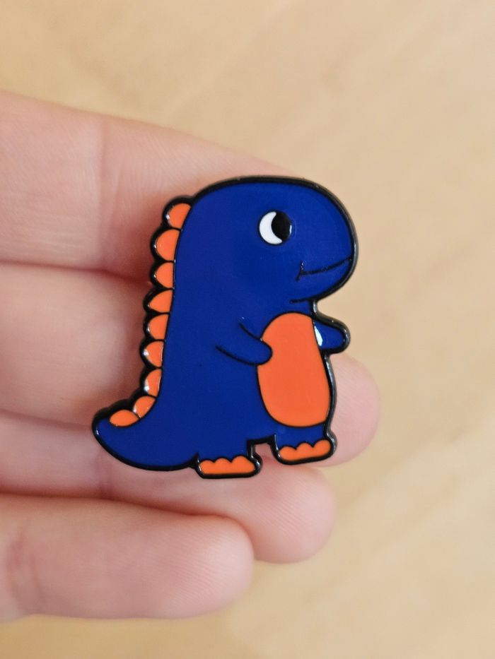 Pin's dinosaure bleu