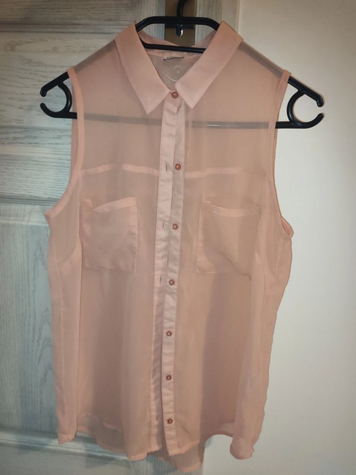 chemise sans manches rose transparent
