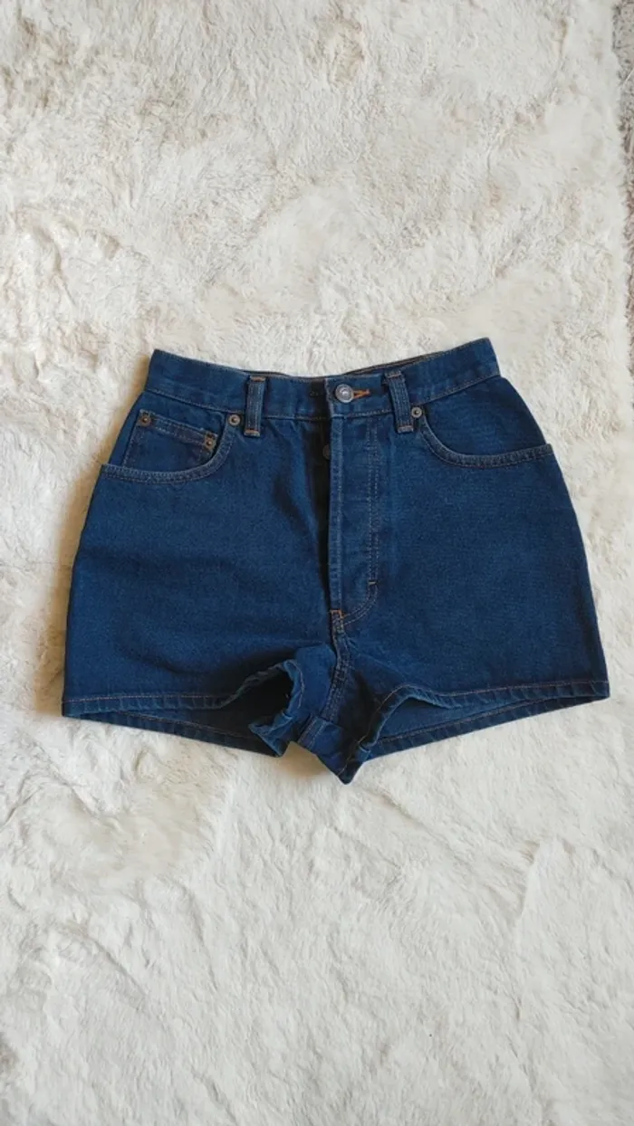 Mini short en jean vintage bleu foncé fermeture bouton