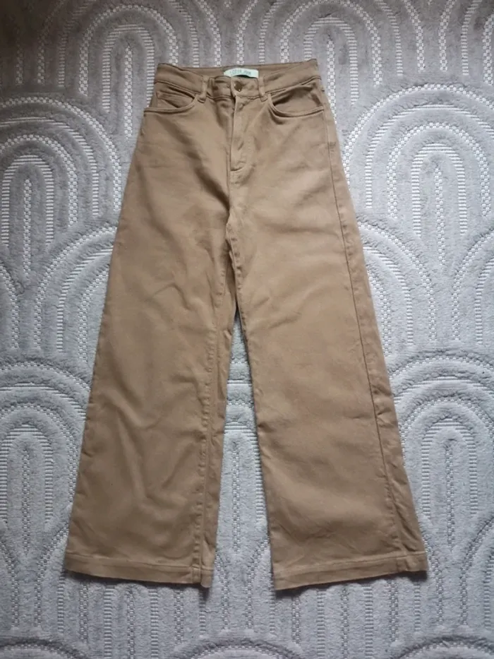 Jean large I. Code