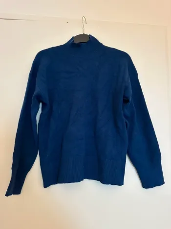 Pull col roulé