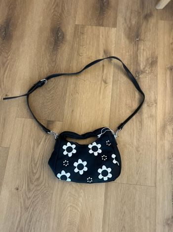 Sac à main noir à fleurs Skinnydip London Festival Daisy