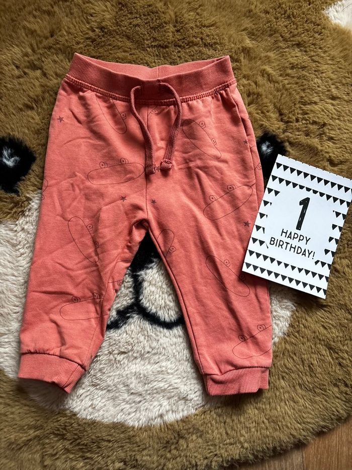 Jogging orange skate/étoiles TEX t.12m