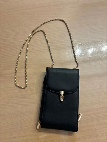 Sac pochette neuve noir et doré