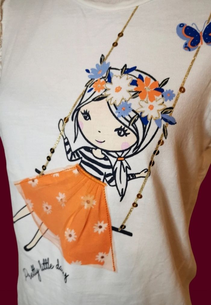 T shirt blanc manches froufrous dentellées motif fille balançoire avec tulle C&A taille 10 ans - photo numéro 2