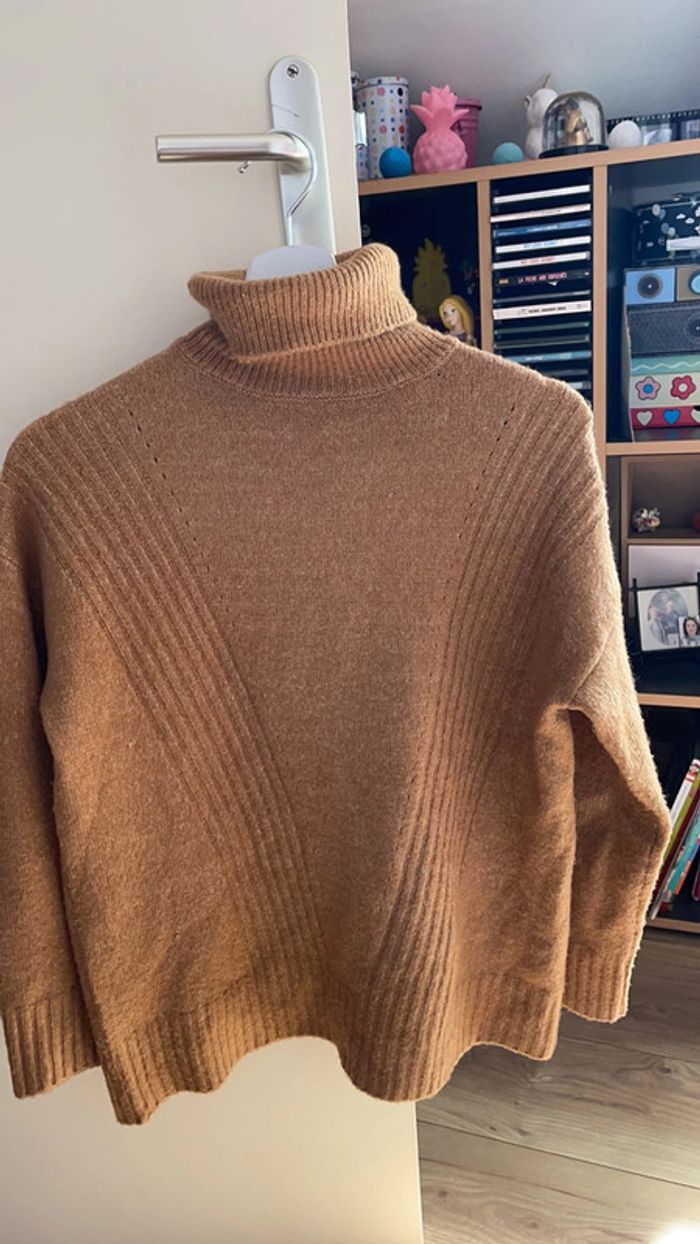 Pull col roulé