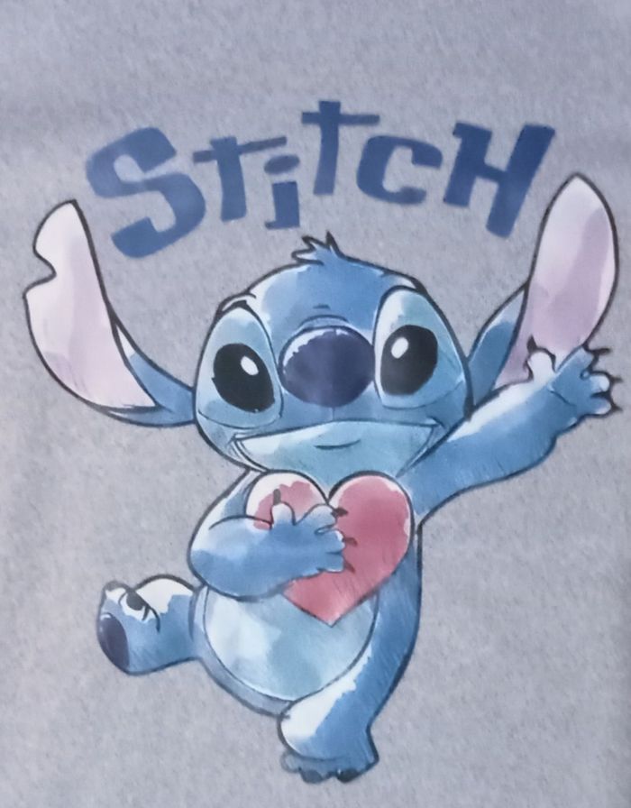 Pull polaire stitch 10 ans neuf