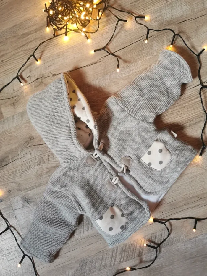 Manteau bébé gris.
