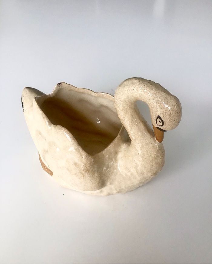 Cygne cache pot ou vide poches