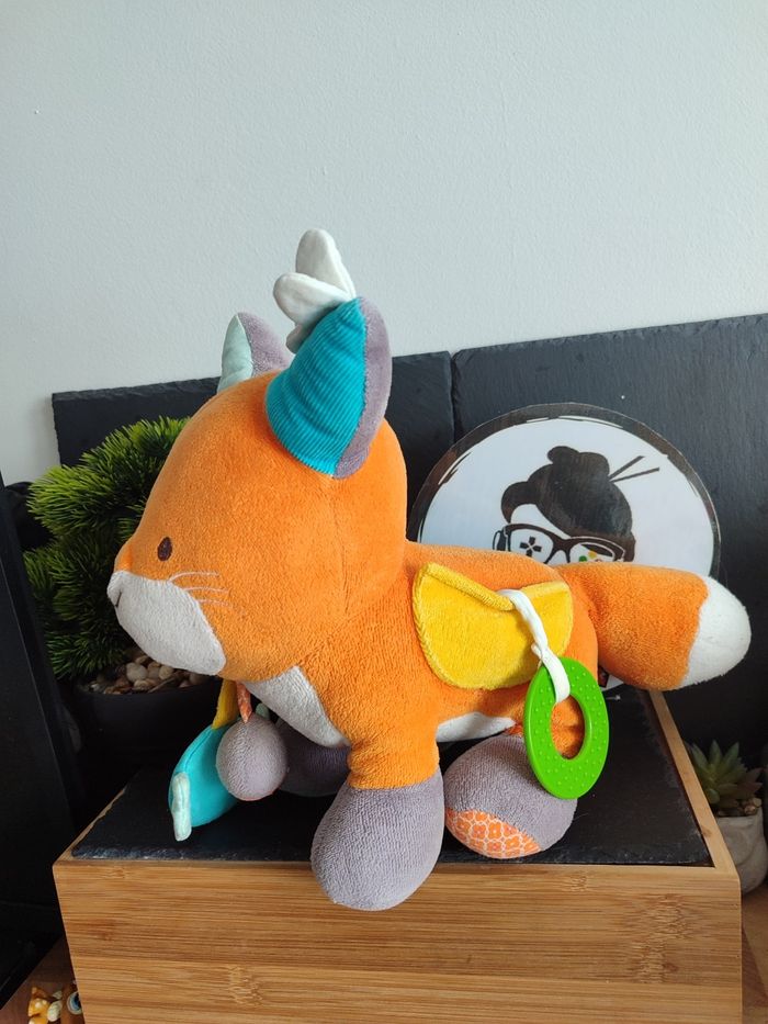 Nature et Découvertes  Peluche coton bio Renard d'activités  orange bleu grelot