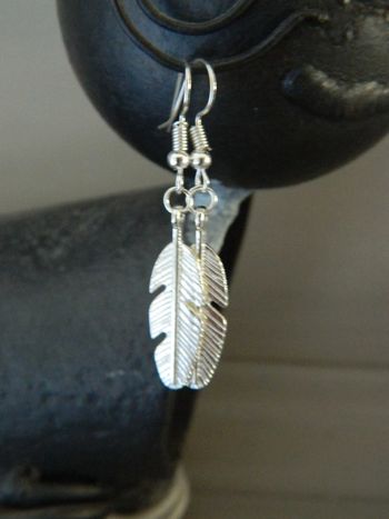 Boucles d'oreilles plumes neuves