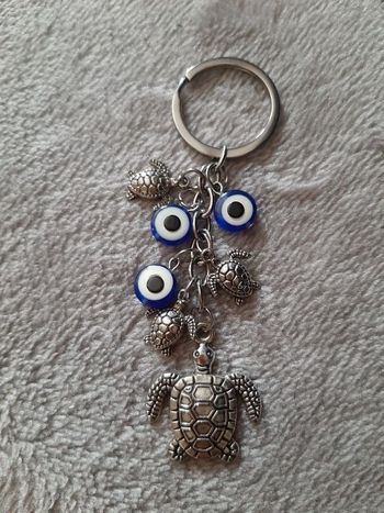 Porte clé tortue œil bleu