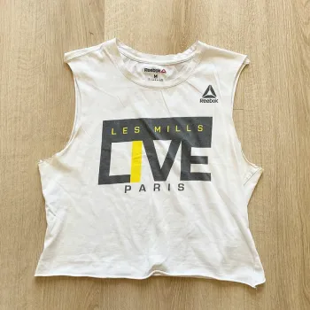 Reebok Mills Live Paris Débardeur Blanc Femme Sport Fitness Crosswear (Taille M)