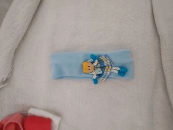 Bandeau avec petit poupée