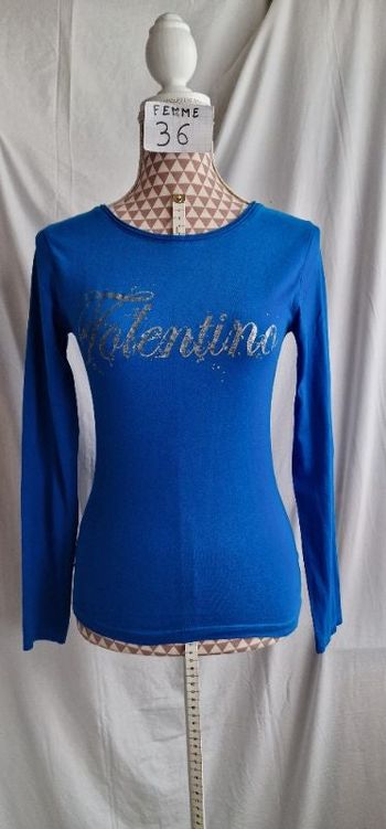 Tee-shirt, ML,bleu électrique, avec motif argenté, en très très bon état, en coton, longueur 57cm