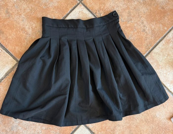 Jupe noire à plis taille xs Jennyfer