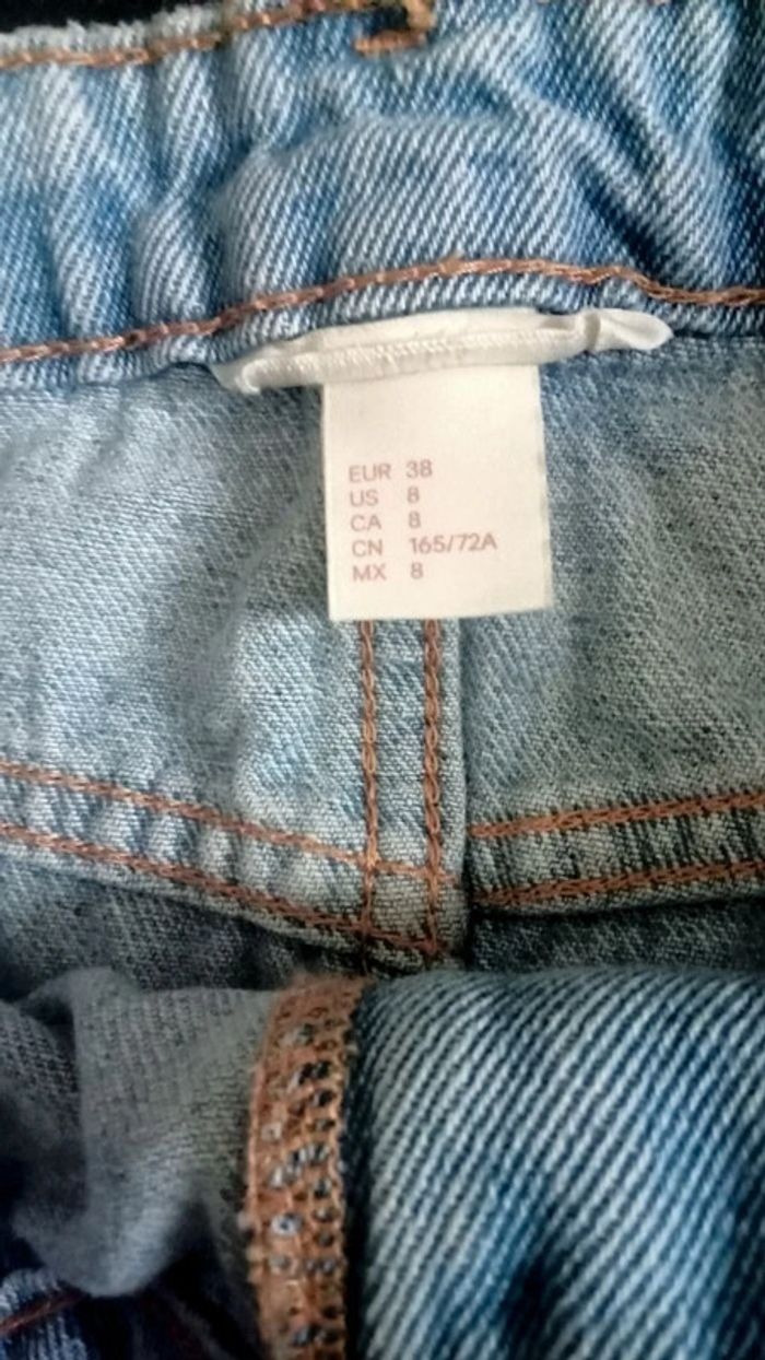 Jupe en jean bleu clair effet déchirer - photo numéro 4