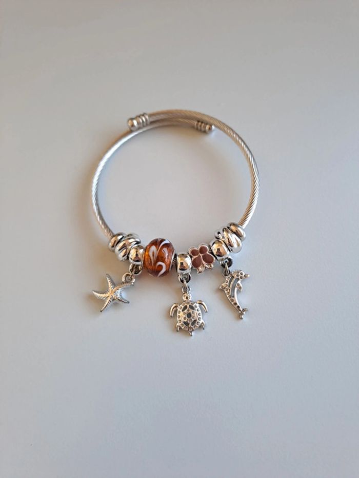 Bracelet acier réglable perles dauphin tortue étoile mer