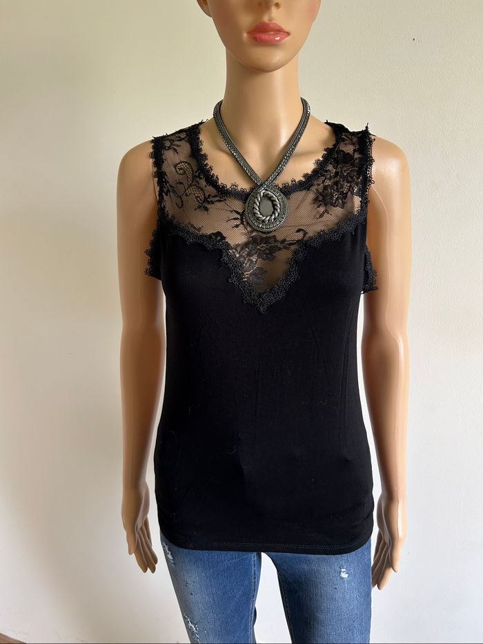 Haut noir sans manches avec dentelle la City taille S jamais porté