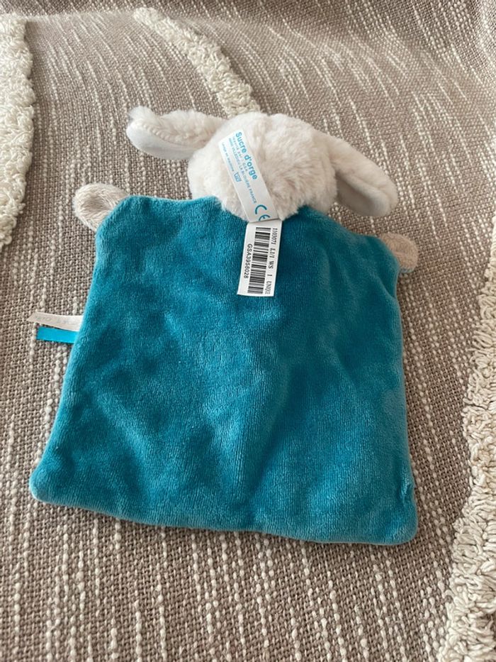 Peluche doudou plat 23cm sucre d’orge chien blanc et bleu parfait état - photo numéro 4