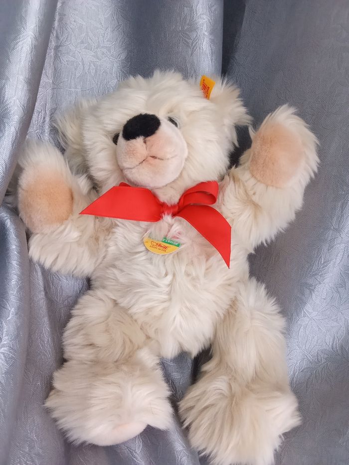 Peluche ours ourson Steiff beige marron clair noeud rouge