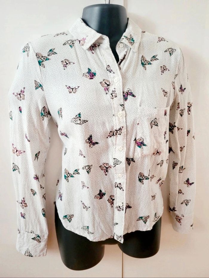 Chemisier chemise coton blanche
papillon multicolores Zara taille
XS 34