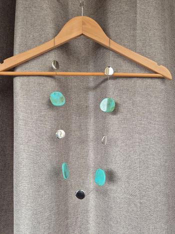 Sautoir bohème perles turquoise et disques argentés