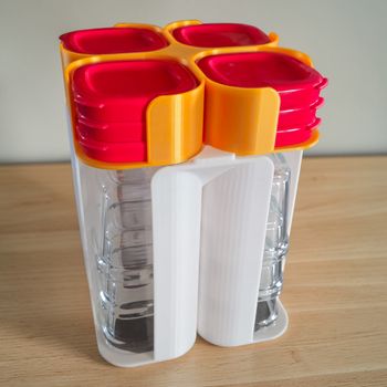 Rangement Blanc et Orange 12 pots & 12 couvercles Multidélices