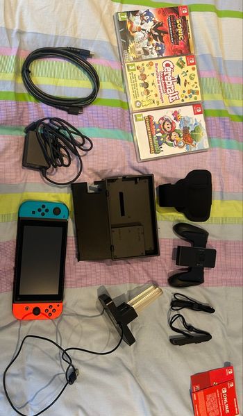 Nintendo switch neuve avec 3 jeux