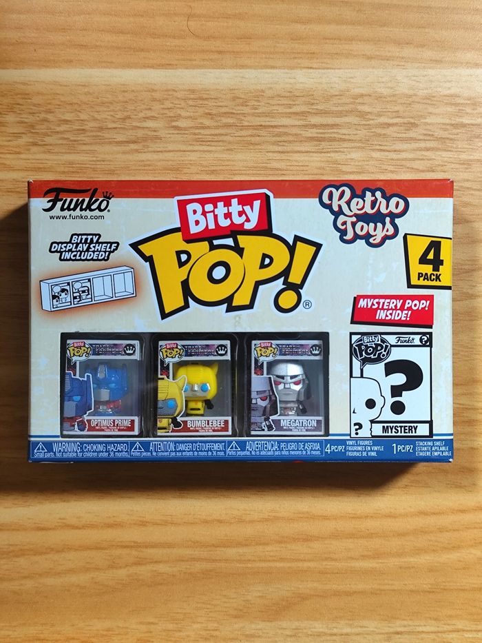 Boîte 4 Bitty Pop! - Optimus Prime, Bumblebee, Megatron + Mystère - Transformers (Retro Toys)