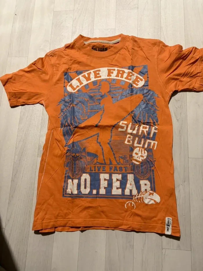 T-shirt 7/8 ans taille grand plutôt 9/10 ans no fear orange manches courtes très bon état
