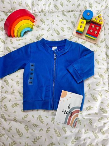 Gilet bleu 6 mois u tout petits neuf