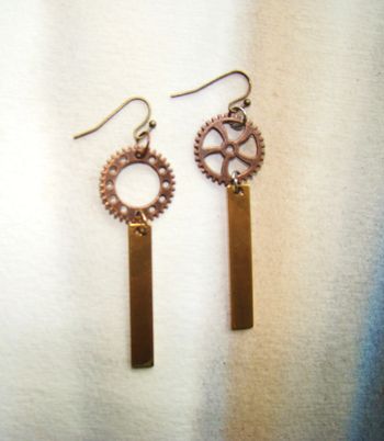 Boucles or cuivrées neuves création rouage asymétrique