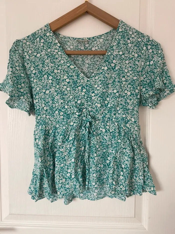 Top peplum fleuris