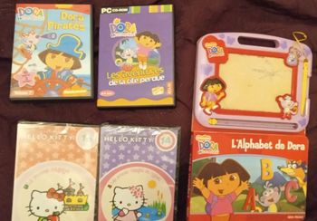 Lot pc 1 cd rom dora +2 DVD hello Kitty sous blister +1 livre ardoise magique dora