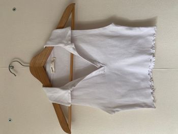 Tee-shirt Polo court sans manche