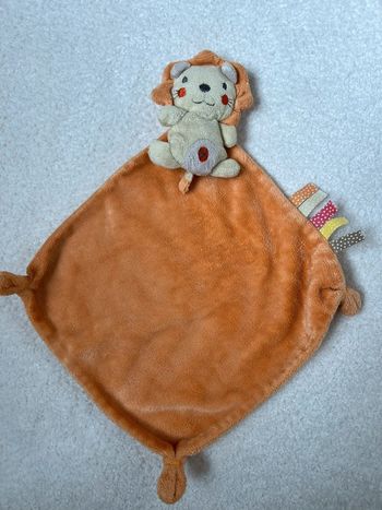 Doudou plat lion orange Nicotoy
