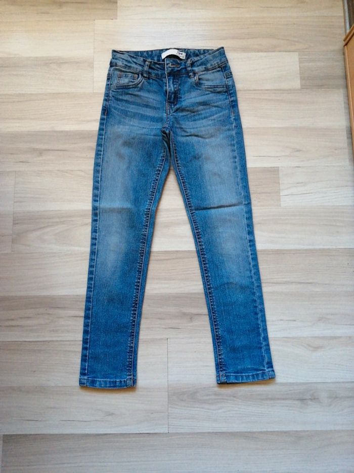 Jean ceinture réglable