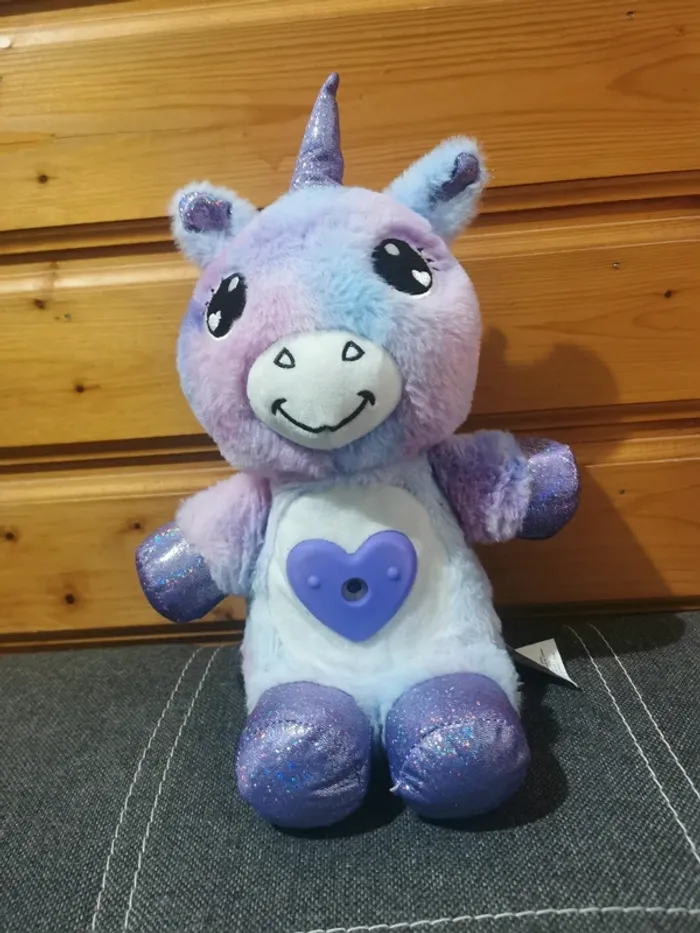 Peluche licorne lumineuse.