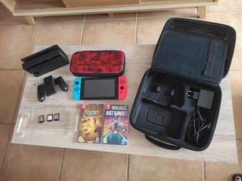 Nintendo Switch avec jeux et pochettes