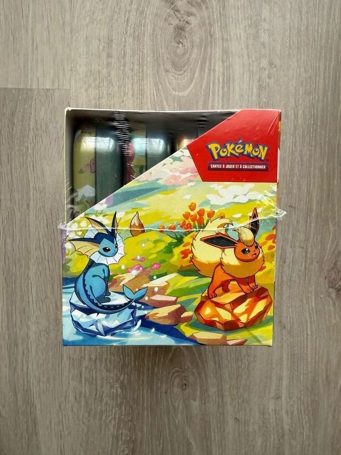 Display Pokémon Mini tins Évolutions Prismatiques EV8.5 Scellée - photo numéro 4