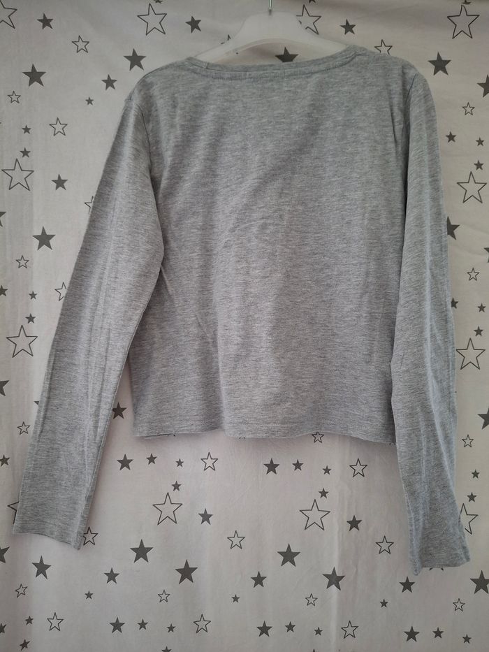 Tee-shirt gris chiné avec impression burger 12 ans Kiabi
Très bon état ni trous ni tache - photo numéro 5