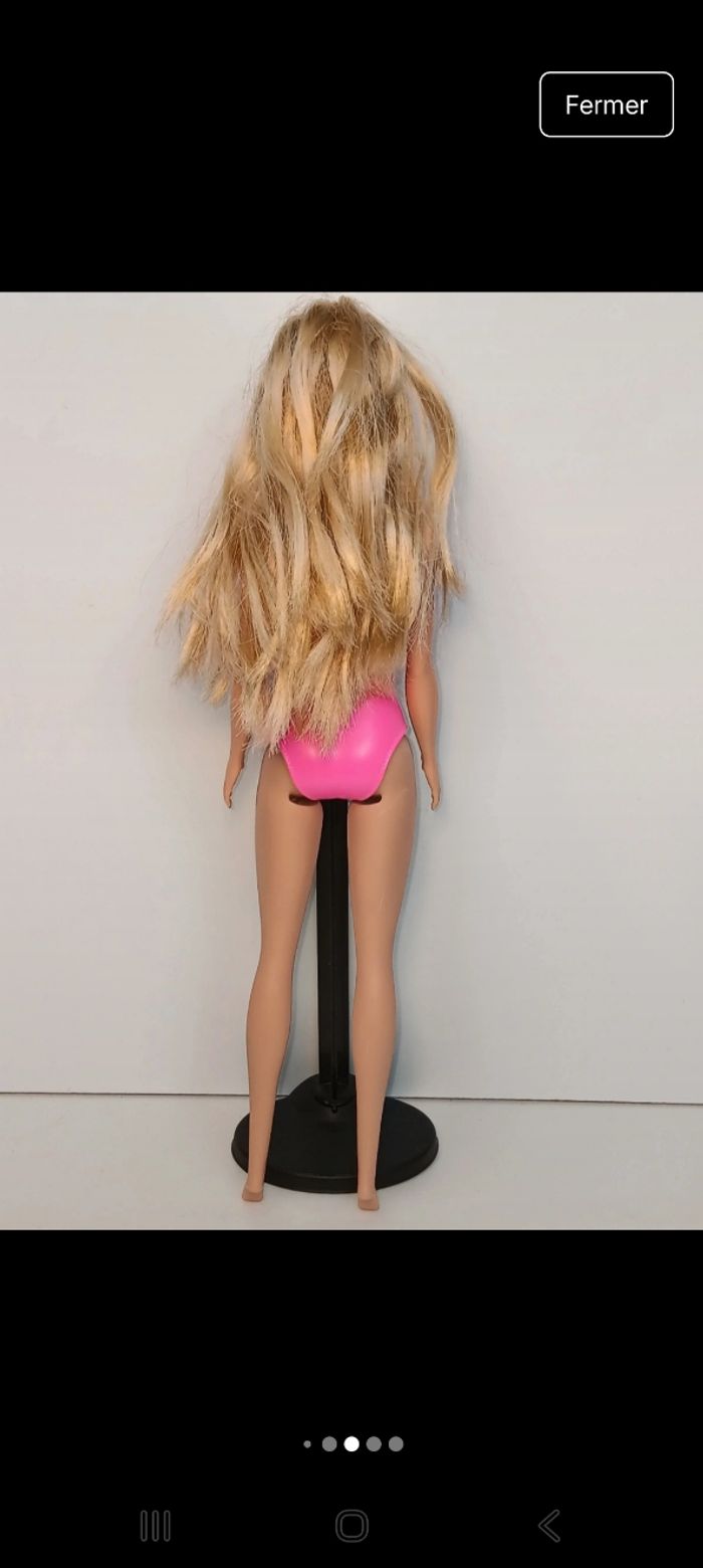 Poupée mattel barbie maillot fushia et mauve tête 2013 corp 2017 
Poupée et ensemble compris - photo numéro 3