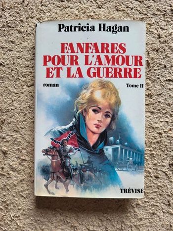 Livre relié "Fanfares pour l'amour et la guerre" de Patricia Hagan